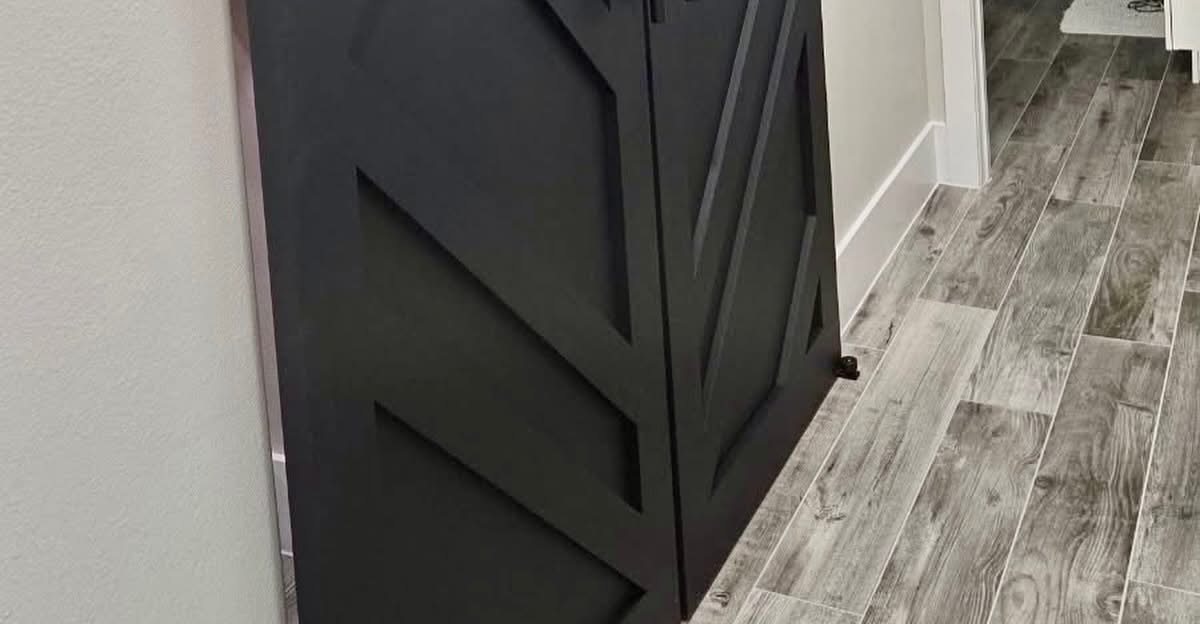 Custom-built sliding barn door with geometric panels